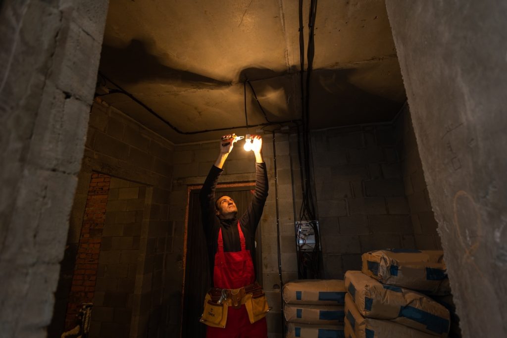 Person in Alberta workplace preparing for fire safety inspection

